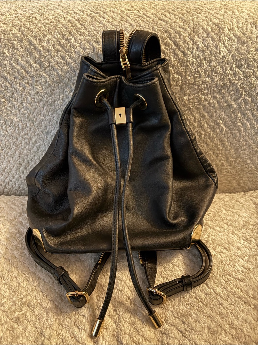 Black Leather Drawstring Backpack with Gold Hardware
